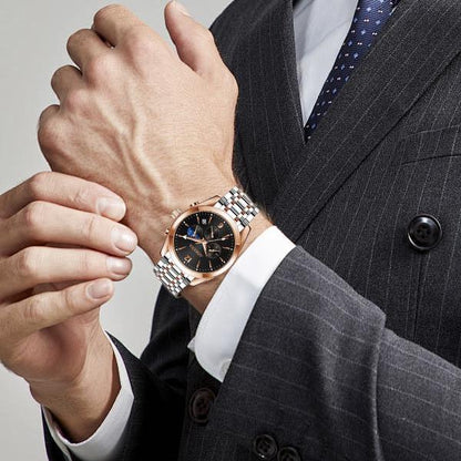 AIMANA Men’s Luxury Chronograph Watch – Crafted from Premium Alloy Steel, Featuring a Luminous Dial, Three Sub-Dials, Date Display & Control Buttons. Available in Two Elegant Colors
